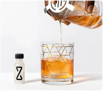 ad for Zbiotics. person pouring a cocktail
