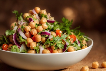 bowl of chickpeas and salad greens