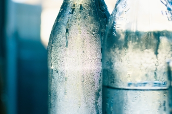 Two glass bottles of cold water
