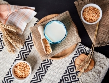 grains and bowl of milk laid on burlap