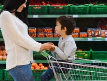 A woman and child shop for healthy foods